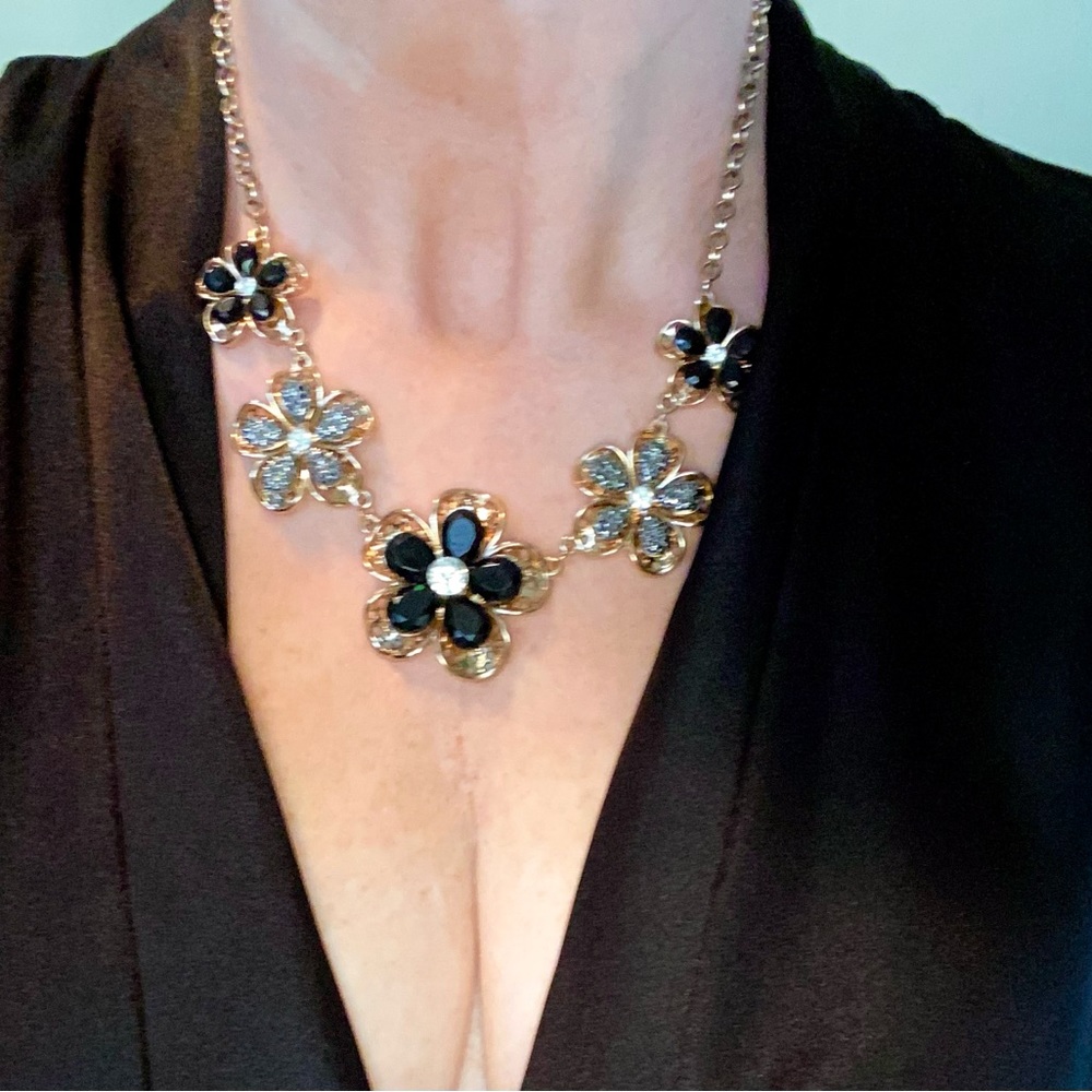 Matching earrings and necklace set. Gold and black with rhinestones.